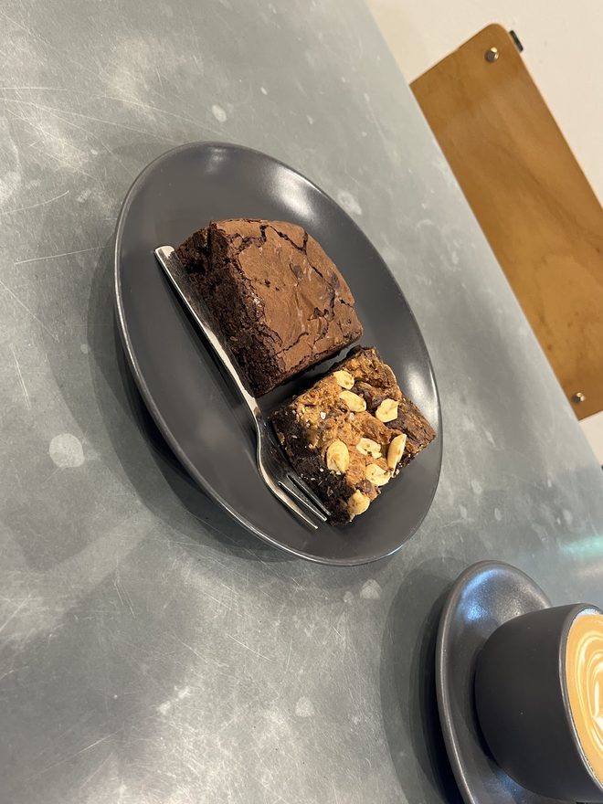 Brownie and coffee on a concrete table
