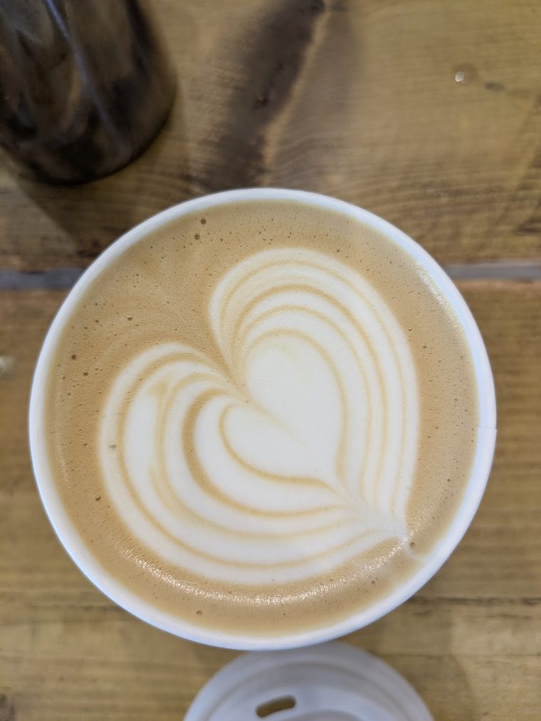 Latte with tulip latte art, shot from above